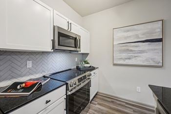 Kitchen with a black countertop